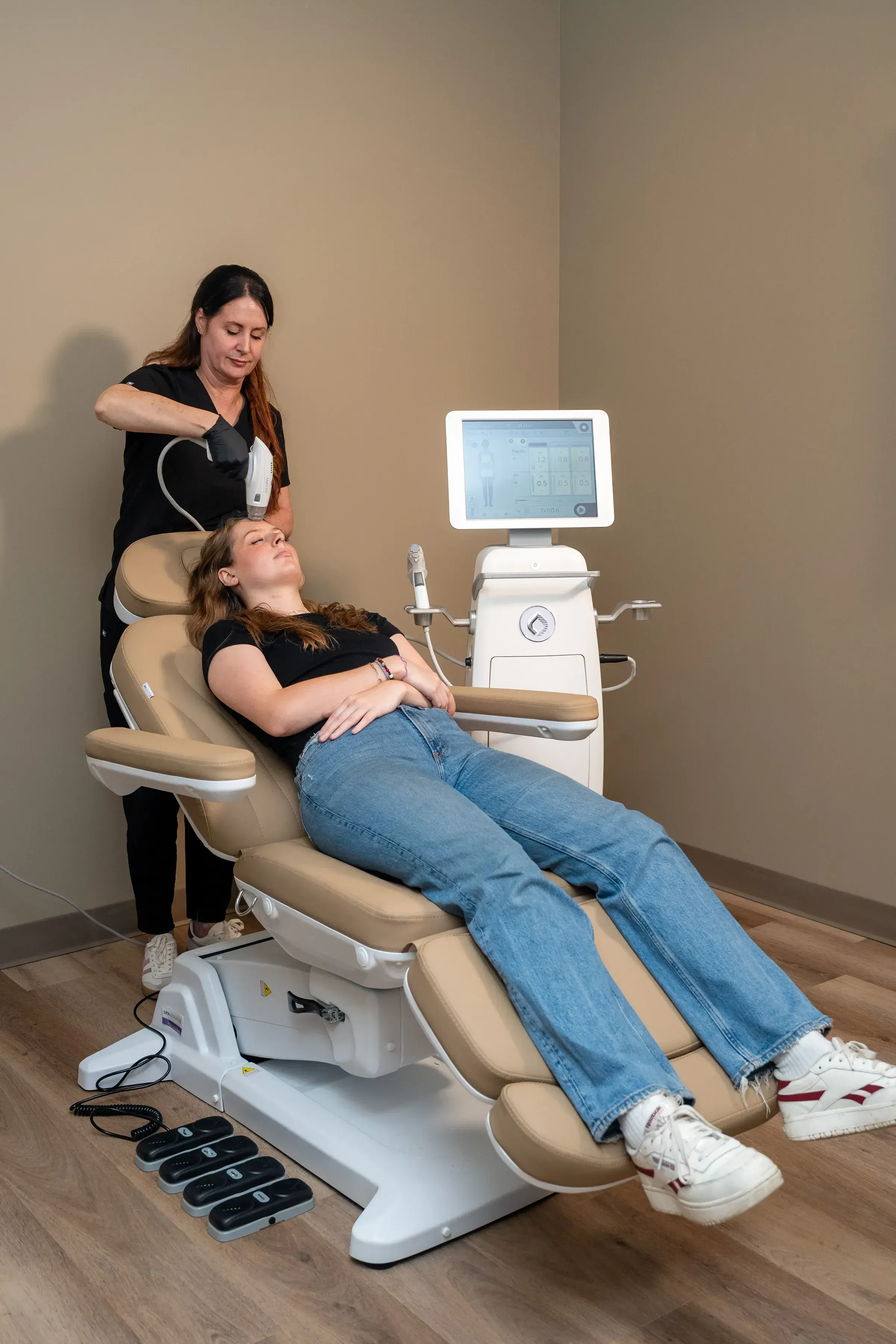 Patient consultation discussing RF Microneedling benefits