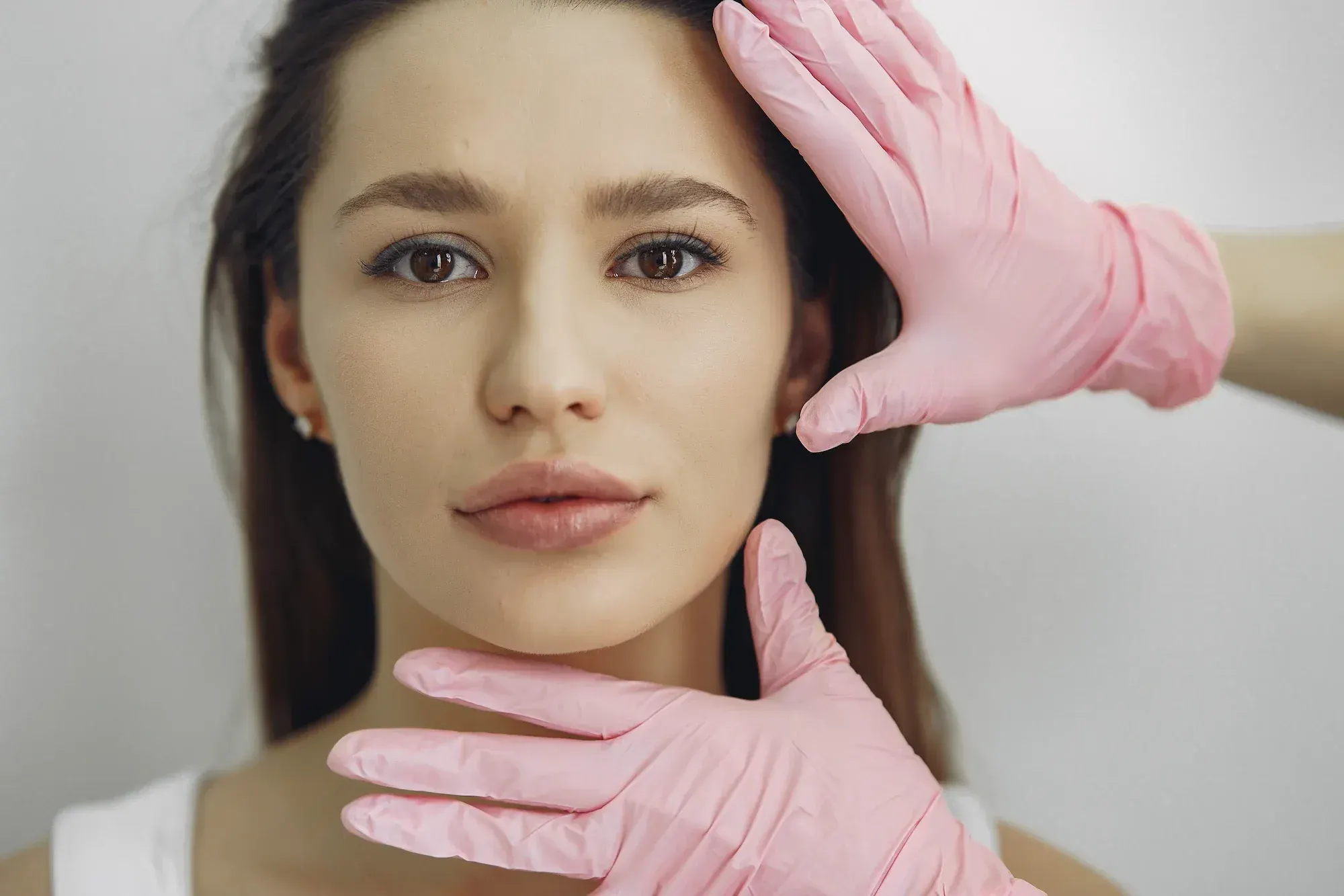 Abstract soft gradient background representing facial rejuvenation possibilities